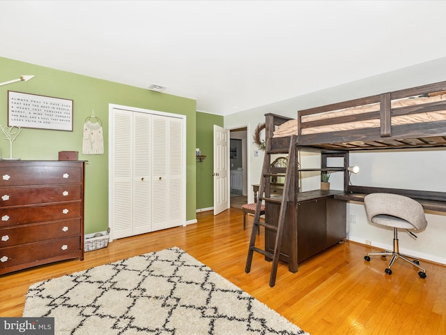 bedroom featuring a closet and wood-type flooring