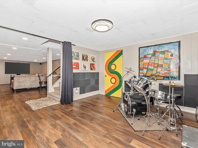 recreation room with ornate columns and hardwood / wood-style floors