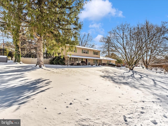 view of snow covered house