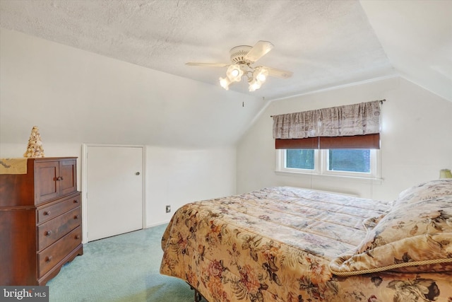 carpeted bedroom featuring a textured ceiling, ceiling fan, and vaulted ceiling