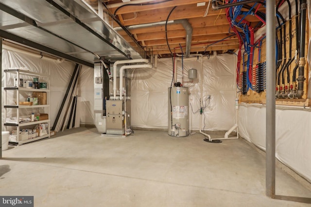 basement featuring gas water heater and heating unit