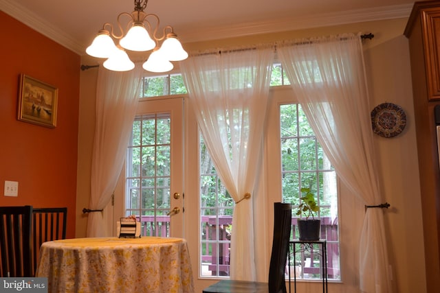 doorway to outside with an inviting chandelier and ornamental molding