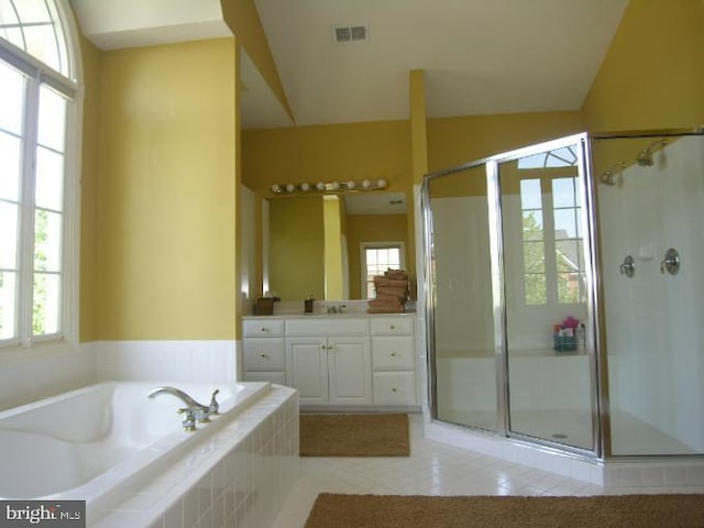 bathroom featuring vanity, visible vents, tile patterned flooring, a shower stall, and a garden tub