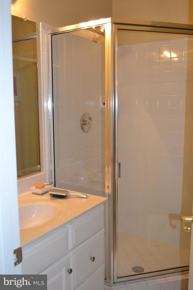 bathroom featuring vanity and a stall shower