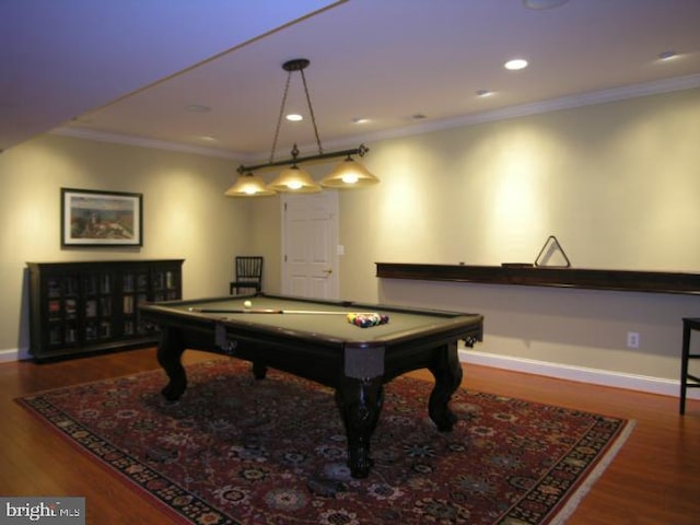 playroom with baseboards, wood finished floors, ornamental molding, and pool table