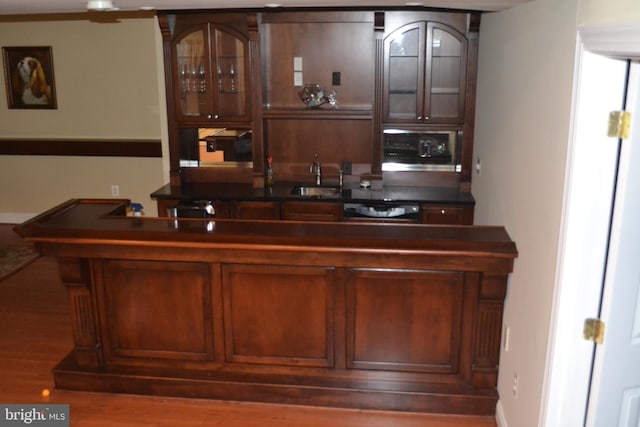 bar with a sink and dishwasher