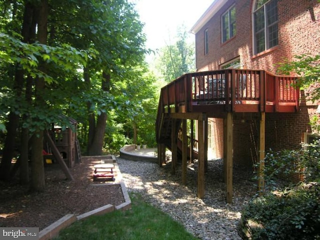 view of yard with stairway and a wooden deck