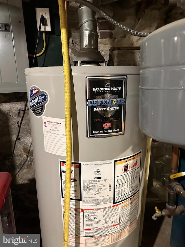 utility room featuring water heater