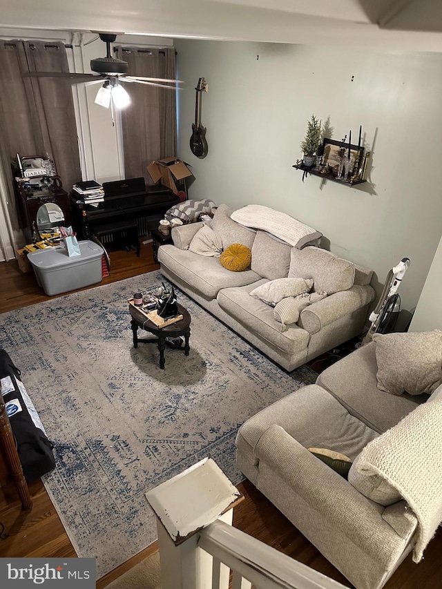 living area with ceiling fan and wood finished floors