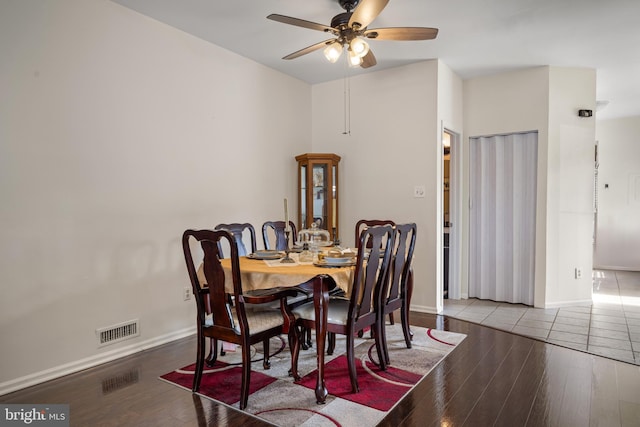 dining room with hardwood / wood-style floors and ceiling fan