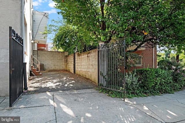 view of gate featuring central AC unit