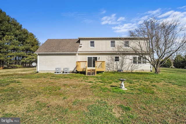 back of property with a wooden deck, a yard, and cooling unit