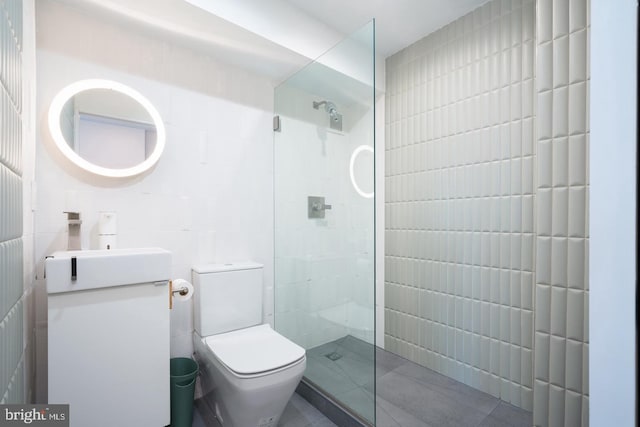 bathroom with a shower, vanity, and toilet