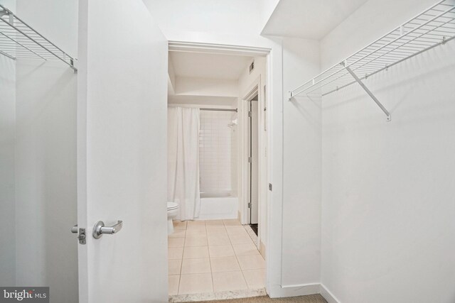 spacious closet with light tile patterned flooring