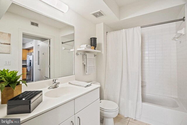 full bathroom with tile patterned flooring, vanity, toilet, and shower / tub combo