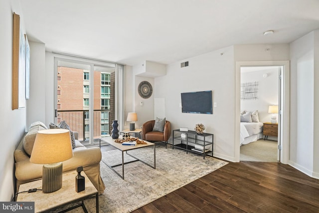 living room featuring dark hardwood / wood-style floors