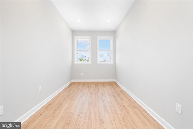 unfurnished room with light wood-type flooring