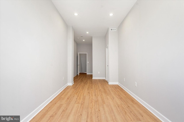 hall with light hardwood / wood-style flooring