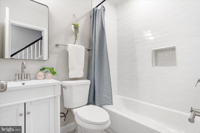 full bathroom featuring vanity, toilet, and shower / tub combo with curtain