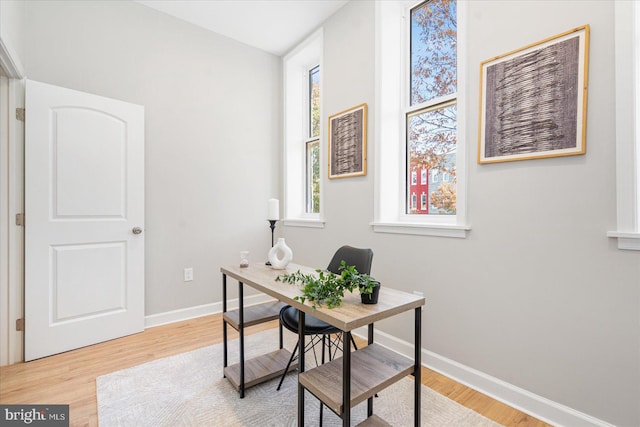 office with light wood-type flooring