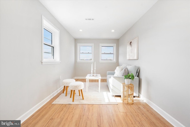 sitting room with light hardwood / wood-style floors