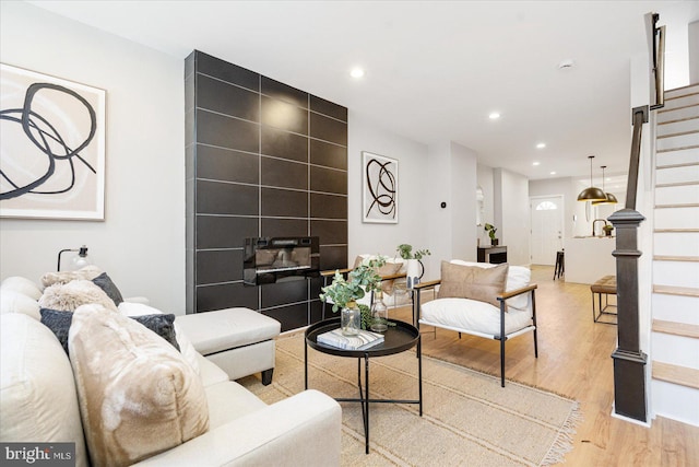 living room with light hardwood / wood-style flooring