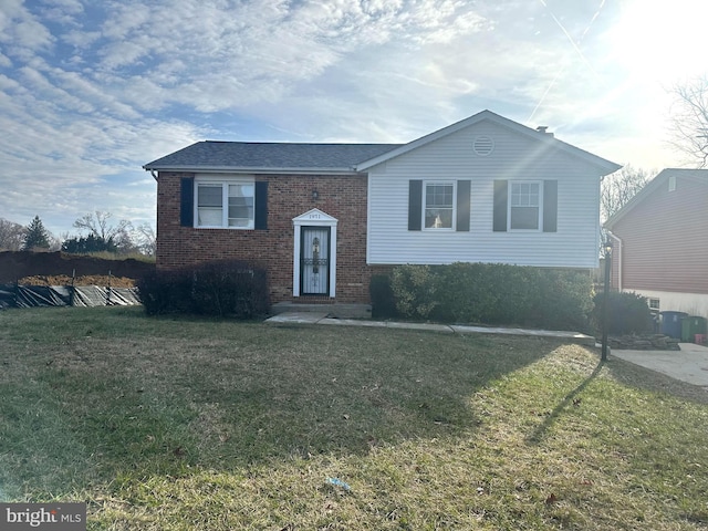 raised ranch with a front lawn