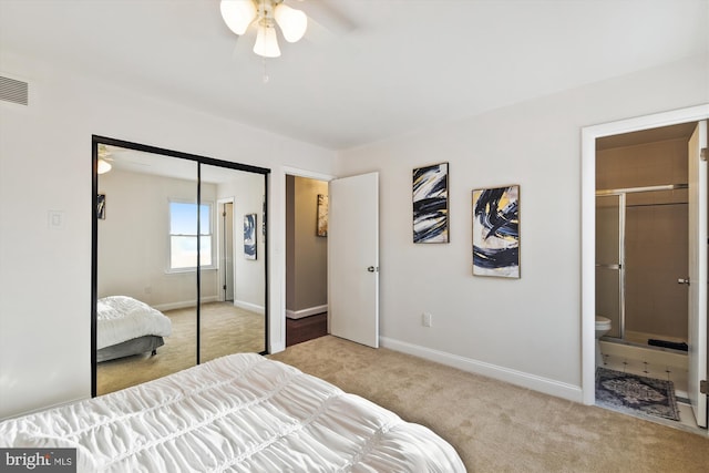 carpeted bedroom featuring ceiling fan, connected bathroom, and a closet