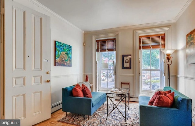 living area with ornamental molding, light parquet floors, a wealth of natural light, and a baseboard heating unit