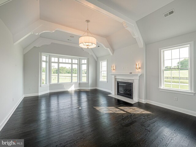 unfurnished living room featuring dark hardwood / wood-style floors, a premium fireplace, and vaulted ceiling