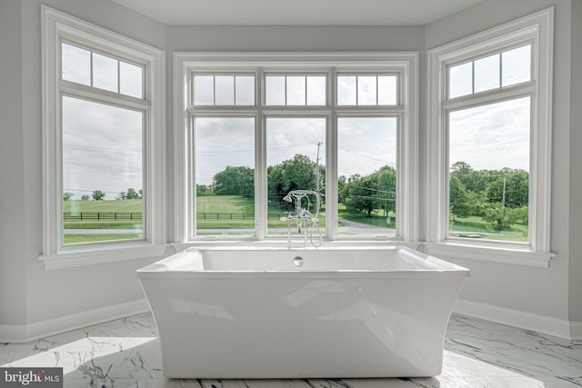 bathroom featuring a tub to relax in