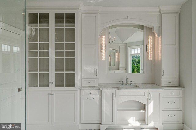 bathroom featuring vanity and an inviting chandelier