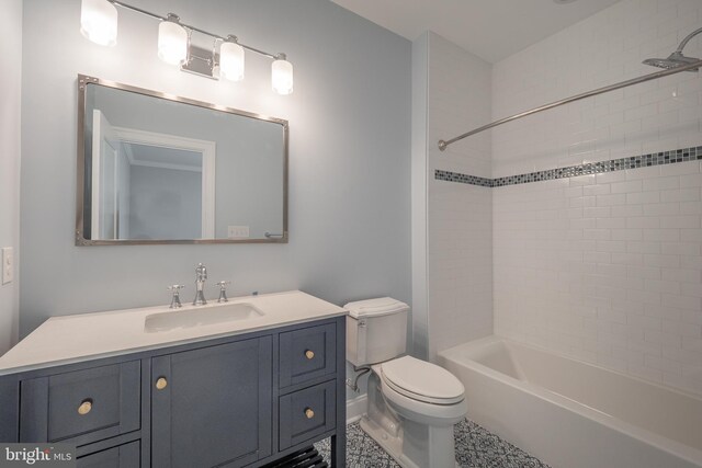 full bathroom with vanity, tiled shower / bath combo, and toilet