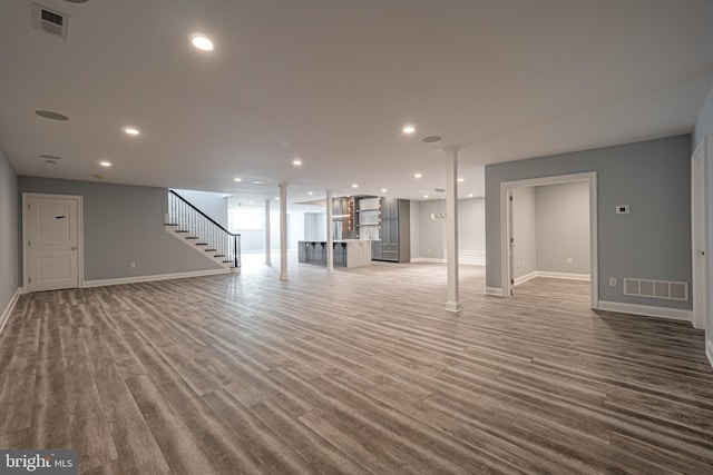 basement with hardwood / wood-style floors