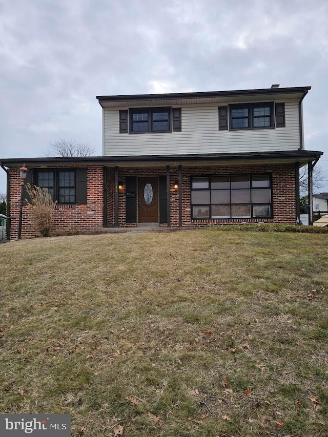 view of property with a front lawn