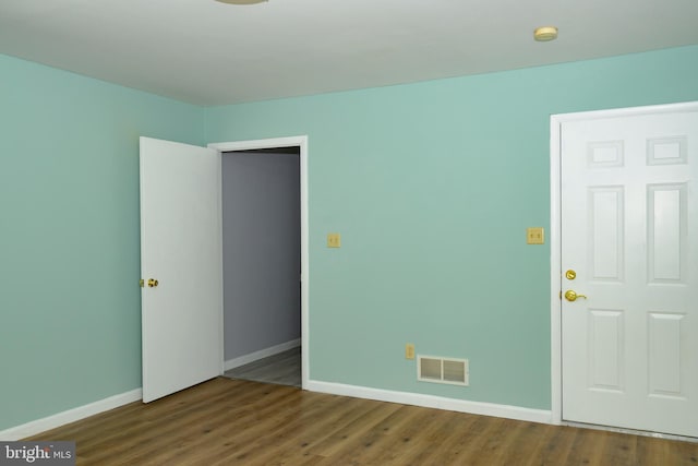 empty room featuring wood-type flooring