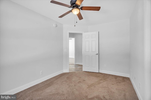 spare room with carpet flooring and ceiling fan