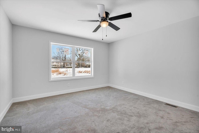 empty room with carpet flooring and ceiling fan