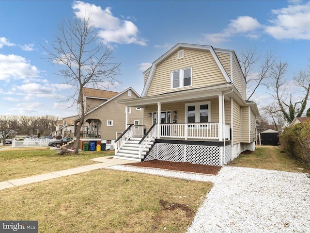 view of front of house with a porch and a front lawn