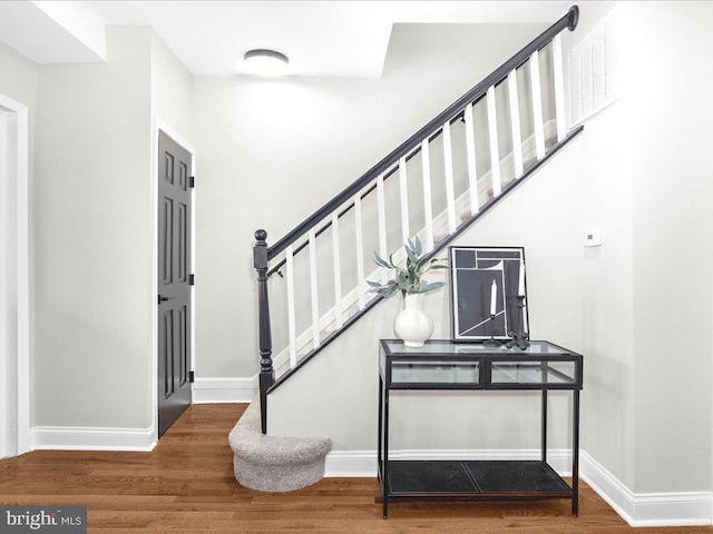 staircase featuring hardwood / wood-style flooring