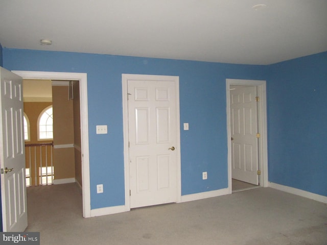 unfurnished bedroom with carpet floors