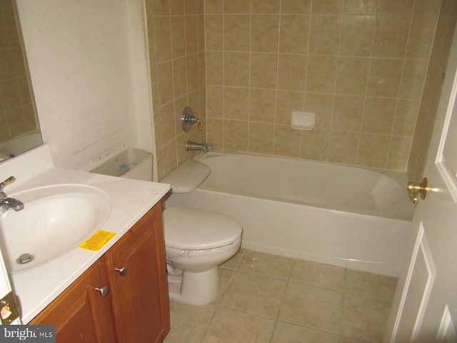 full bathroom featuring tile patterned floors, vanity, toilet, and tiled shower / bath