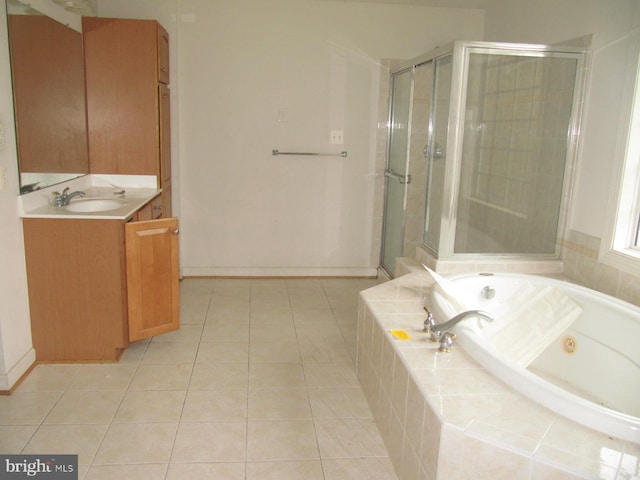 bathroom with tile patterned flooring, vanity, and independent shower and bath