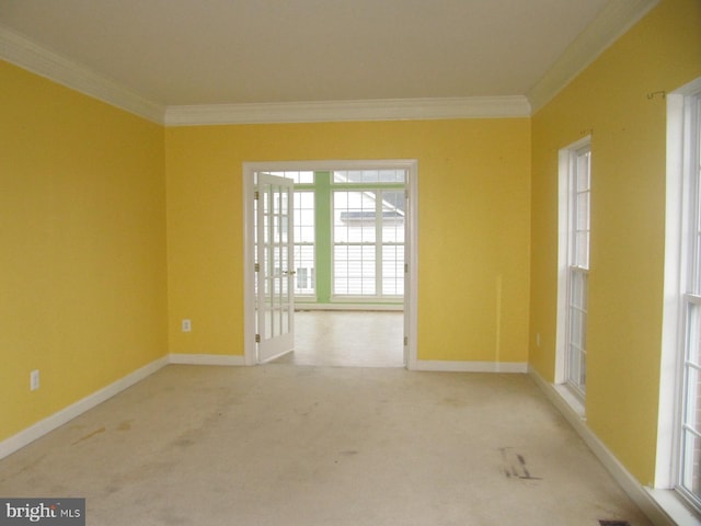 unfurnished room featuring light colored carpet and ornamental molding