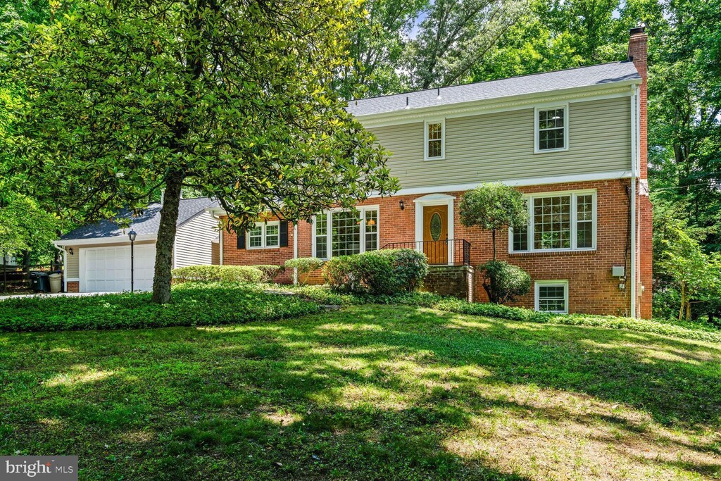 colonial-style house with a front yard