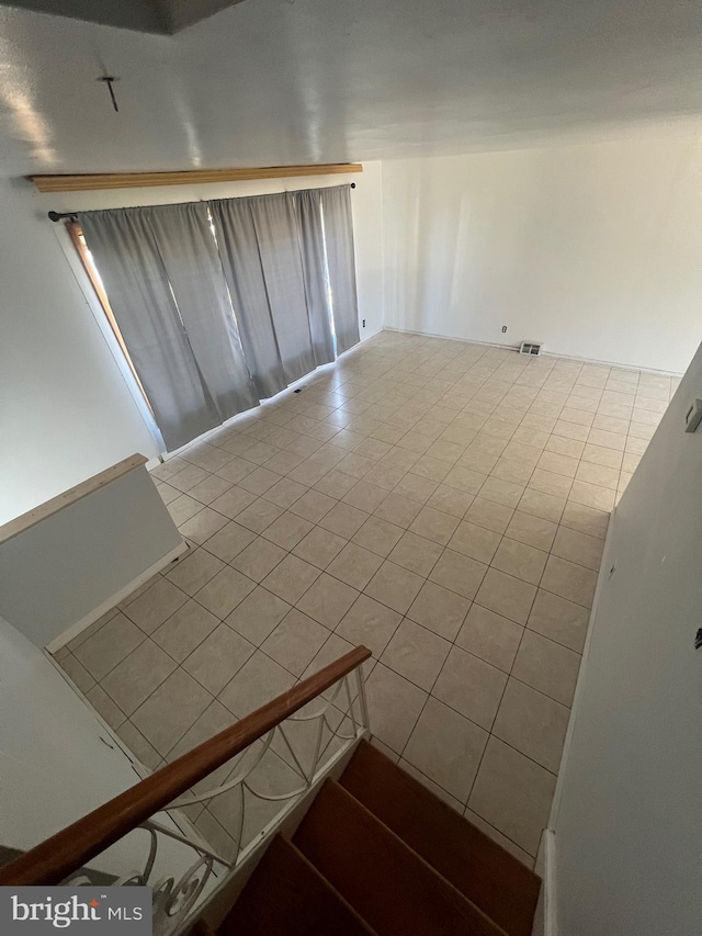 stairs with tile patterned floors