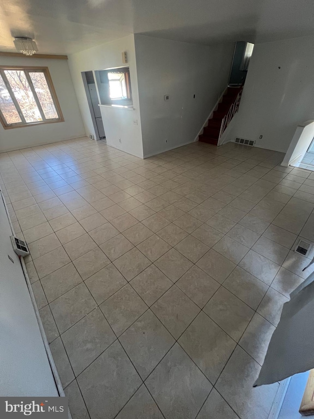 unfurnished room featuring light tile patterned floors