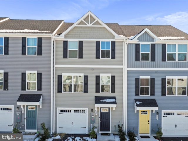 townhome / multi-family property featuring a garage