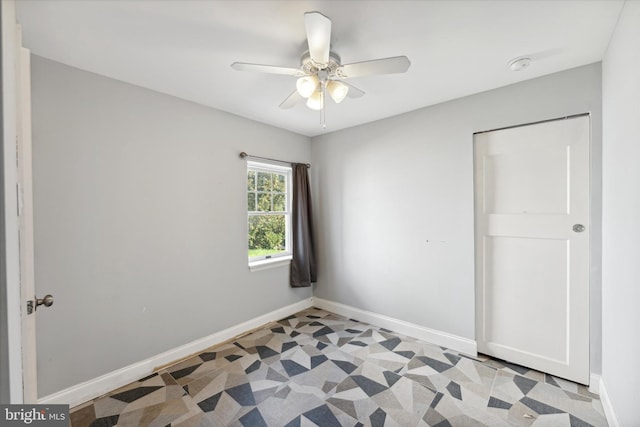 unfurnished bedroom featuring ceiling fan