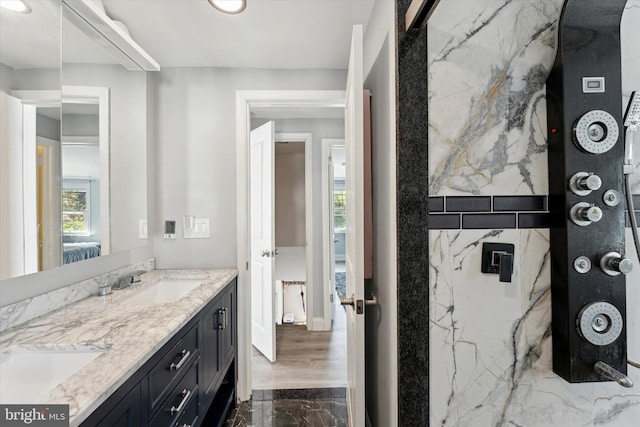 bathroom with plenty of natural light and vanity